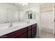 Bathroom features a double sink vanity with a large mirror and shower/bath combo at 4102 S 186Th Ave, Goodyear, AZ 85338