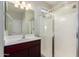 Modern bathroom with glass shower enclosure, vanity, and contemporary fixtures at 4102 S 186Th Ave, Goodyear, AZ 85338