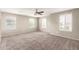 Spacious bedroom with carpet, ample natural light, and modern fixtures at 4102 S 186Th Ave, Goodyear, AZ 85338