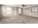 Bedroom with carpet, lots of light, and a view to another room through an open doorway at 4102 S 186Th Ave, Goodyear, AZ 85338