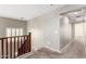 Hallway leading to other rooms, offering natural light and access to the staircase at 4102 S 186Th Ave, Goodyear, AZ 85338