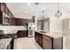 Well-equipped kitchen featuring stainless steel appliances, a tiled backsplash, and a granite island at 4102 S 186Th Ave, Goodyear, AZ 85338