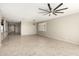 Bright living room with neutral walls, tile flooring, and a view to the front entryway at 4102 S 186Th Ave, Goodyear, AZ 85338