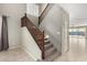 Carpeted staircase with wood banister, leading to the second story at 4102 S 186Th Ave, Goodyear, AZ 85338