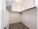 Walk-in closet with carpet and built-in shelving perfect for organizing any wardrobe at 4102 S 186Th Ave, Goodyear, AZ 85338