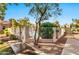 View of the community pool gate surrounded by sidewalks and meticulous landscaping at 500 N Roosevelt Ave # 92, Chandler, AZ 85226