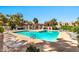 Inviting community pool with ample lounge chairs and lush landscaping in a relaxing atmosphere at 500 N Roosevelt Ave # 92, Chandler, AZ 85226