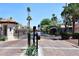 Wrought iron community gate and gatehouse entrance offer privacy and security to residents at 6701 N Scottsdale Rd # 20, Scottsdale, AZ 85250