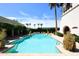 Inviting community pool surrounded by lush landscaping and plenty of space to lounge at 6701 N Scottsdale Rd # 20, Scottsdale, AZ 85250