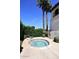 Cozy community hot tub surrounded by lush greenery, offering a private and relaxing retreat at 6701 N Scottsdale Rd # 20, Scottsdale, AZ 85250