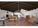 Spacious living room boasts high ceilings, a fireplace, and rustic tile flooring throughout at 6701 N Scottsdale Rd # 20, Scottsdale, AZ 85250