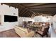 Expansive living area with high ceilings, comfortable seating, and a rustic tile floor at 6701 N Scottsdale Rd # 20, Scottsdale, AZ 85250