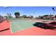 Community tennis courts available, surrounded by lush trees and neighborhood homes on a sunny day at 6701 N Scottsdale Rd # 20, Scottsdale, AZ 85250