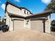 Detached two car garage with a well maintained paved driveway and mature trees at 1948 W Busoni Pl, Phoenix, AZ 85023