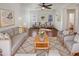 Bright and spacious living room with modern decor, a cozy seating arrangement, and ample natural light at 1948 W Busoni Pl, Phoenix, AZ 85023