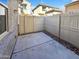 Enclosed patio with concrete slab and rock landscaping, perfect for outdoor seating and relaxation at 1948 W Busoni Pl, Phoenix, AZ 85023