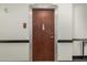 Apartment entrance door with modern hardware and decorative trim at 114 W Adams St # 506, Phoenix, AZ 85003
