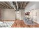 Dining area features hardwood floors, exposed ductwork, concrete pillars and is adjacent to the kitchen at 114 W Adams St # 506, Phoenix, AZ 85003