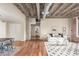 Spacious living room with concrete ceilings and exposed ductwork with a dining area and hardwood floors at 114 W Adams St # 506, Phoenix, AZ 85003