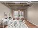 Bright living room boasts concrete ceilings, exposed ductwork, brick accents, and hardwood floors at 114 W Adams St # 506, Phoenix, AZ 85003