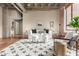 Bright living room with a concrete ceiling, hardwood floors, and exposed brick, offering a modern aesthetic at 114 W Adams St # 506, Phoenix, AZ 85003