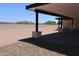 Modern patio with pavers, desert landscaping, and shaded structure perfect for outdoor living at 3877 S Veronica Ln, Gold Canyon, AZ 85118