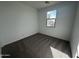 Simple bedroom with carpet flooring and window at 4280 E Bradford Ave, San Tan Valley, AZ 85143