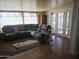 Living room with sectional sofa and access to patio at 10307 W Oakmont Dr, Sun City, AZ 85351