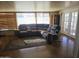 Living room with sectional sofa and access to patio at 10307 W Oakmont Dr, Sun City, AZ 85351