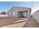 House exterior with covered patio and yard at 11458 E Utah Ave, Mesa, AZ 85212