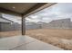 Large backyard with expansive patio and block wall fencing at 35176 N Lead Way, San Tan Valley, AZ 85144