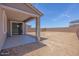 Expansive backyard space featuring a covered patio area, perfect for outdoor entertaining and relaxation at 17626 W Oregon Ave, Litchfield Park, AZ 85340
