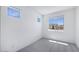 Bedroom featuring plush carpeting, multiple windows offering ample natural light and neighborhood views at 17626 W Oregon Ave, Litchfield Park, AZ 85340