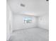 Bright bedroom with plush carpeting, a large window, and neutral wall color creating a calming atmosphere at 17626 W Oregon Ave, Litchfield Park, AZ 85340