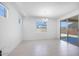 Bright dining room featuring tile floors, a modern chandelier, and sliding doors to outdoor space at 17626 W Oregon Ave, Litchfield Park, AZ 85340