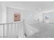 Upstairs loft area with carpet, white walls, and natural light at 17626 W Oregon Ave, Litchfield Park, AZ 85340