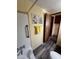Cozy bathroom featuring vinyl floors, and desert-themed wall art, creating a tranquil and stylish space at 9427 E University Dr # 46, Mesa, AZ 85207