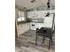 Charming kitchen with white cabinets, modern appliances, and a dining area for convenient meals at 9427 E University Dr # 46, Mesa, AZ 85207