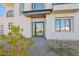 Modern front entrance with glass door and stone pathway at 100 W Northern Ave # 15, Phoenix, AZ 85021