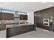 Spacious kitchen with dark cabinetry, quartz countertops and island at 100 W Northern Ave # 15, Phoenix, AZ 85021