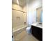 Clean bathroom featuring a bathtub, shower, and dark fixtures at 23978 S 218Th Pl, Queen Creek, AZ 85142
