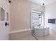 Elegant bathroom showcasing a glass-enclosed shower, soaking tub, and minimalist design elements for a serene ambiance at 23978 S 218Th Pl, Queen Creek, AZ 85142