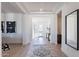 Bright and airy foyer features sleek flooring, high ceilings, and an open layout with decorative rug at 23978 S 218Th Pl, Queen Creek, AZ 85142