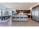 Open concept kitchen and dining area featuring a large central island with seating at 23978 S 218Th Pl, Queen Creek, AZ 85142
