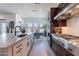 Gourmet kitchen featuring a large island, stainless appliances and an adjacent dining area at 23978 S 218Th Pl, Queen Creek, AZ 85142