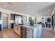 Bright kitchen featuring a large central island, stainless steel appliances, and open layout at 23978 S 218Th Pl, Queen Creek, AZ 85142