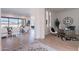 Open-concept living space featuring modern furniture, bright lighting, hardwood floors, and decorative elements at 23978 S 218Th Pl, Queen Creek, AZ 85142