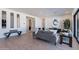 Contemporary living room with sleek furniture, modern art, and a bright, airy atmosphere at 23978 S 218Th Pl, Queen Creek, AZ 85142