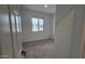 Carpeted bedroom featuring a large window, white walls, and ample natural light at 37609 N Cowboy Ln, San Tan Valley, AZ 85140