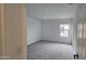 Bedroom with neutral carpet, white walls, and a window with natural light at 37609 N Cowboy Ln, San Tan Valley, AZ 85140